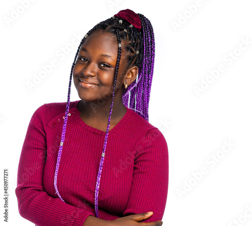 Up close image of an African teenage girl smiling.