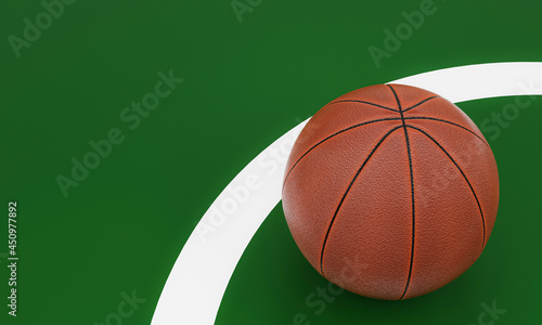 Basketball ball placed on the green playing field. Team sports equipment. 3D rendering