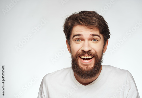 emotional man in a white t-shirt serious look close-up