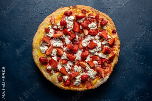 Strawberry and banana pizza with ricotta cheese and mango sauce.