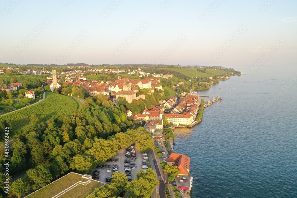 Wide Aerial Drone Shot of the City of Meersburg at Lake Constance, Germany while golden hour