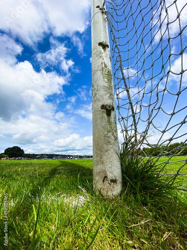 Detail shot of an old Gaelic games rusted goal post on a cloudy day photo