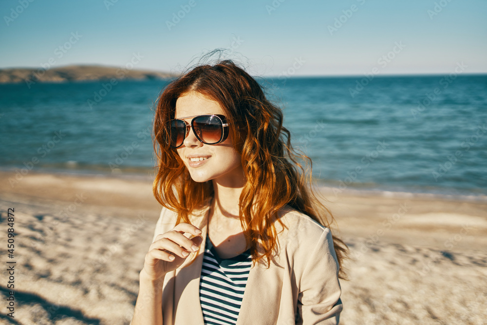 woman in sunglasses on the beach sea landscape summer woman in sunglasses on the beach sea landscape summer