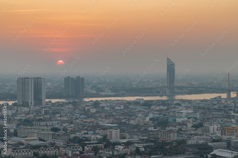 Bangkok, Thailand - Jan 12, 2021 : Aerial view of Amazing beautiful scenery view of Bangkok City skyline and skyscraper before sun setting creates relaxing feeling for the rest of the day. Evening tim