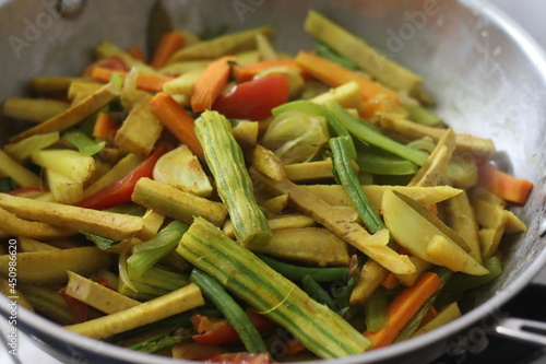 Chopped vegetables in the cooking pan while cooking for Aviyal, a popular kerala dish photo