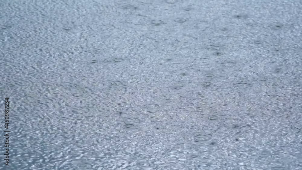 rain falling into the river, Rain splashes, heavy rain, close-up. rain falling into the river, Rain splashes, heavy rain, close-up.