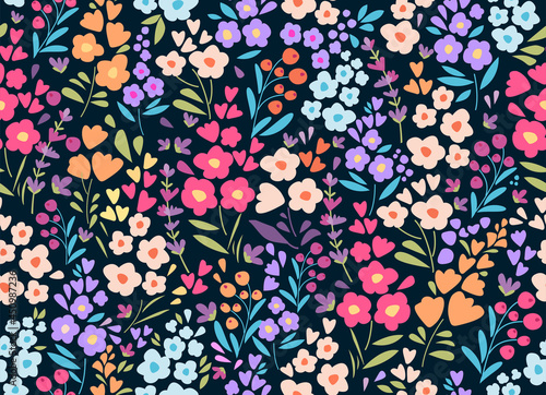 Seamless pattern with colorful small flowers and leaves