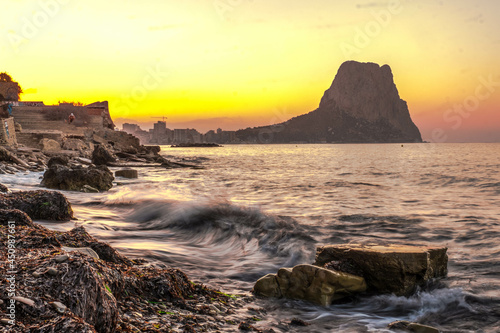 Calpe at sunrise on the Mediterranean coast of Alicante, Spain with views of the Ifach Rock