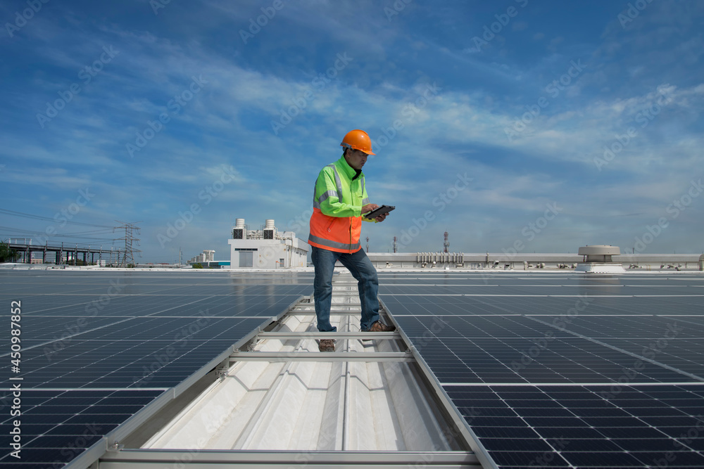Male solar cell engineer is working hard. Working in alternative energy Solar energy. Engineers in the Solar Energy field Male solar cell engineer is working hard. Working in alternative energy Solar energy. Engineers in the Solar Energy field
