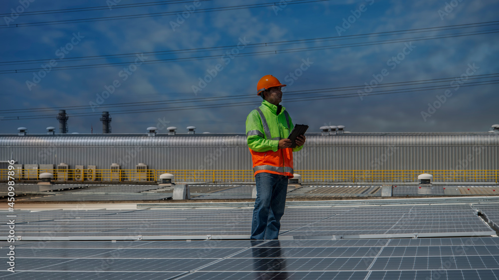 Male solar cell engineer is working hard. Working in alternative energy Solar energy. Engineers in the Solar Energy field Male solar cell engineer is working hard. Working in alternative energy Solar energy. Engineers in the Solar Energy field