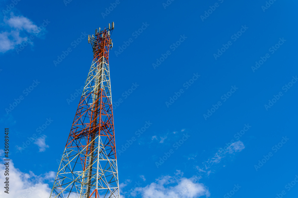 Telecommunication cellular phone tower in blue sky. Telecommunication cellular phone tower in blue sky.