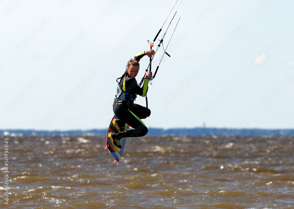 Freestyle - a girl jumps on a kite Freestyle - a girl jumps on a kite