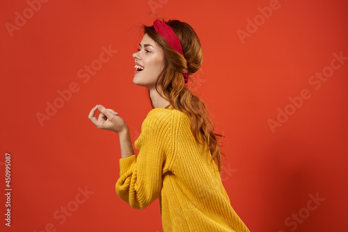 cheerful woman in yellow sweater red headband decoration fashion street style