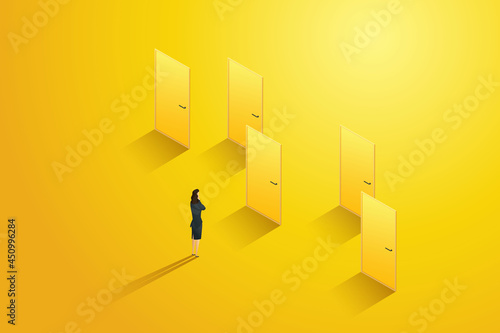 Businesswoman stands in front of several doors thinking choosing one.