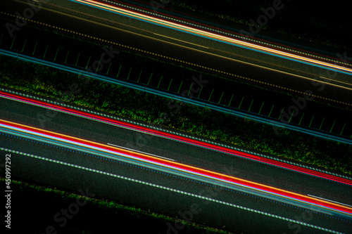 Night road lights. Lights of moving cars at night. long exposure multicolored