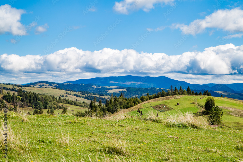 view of meadows and mountains on a beautiful clear day. beautiful landscape of the mountain range.