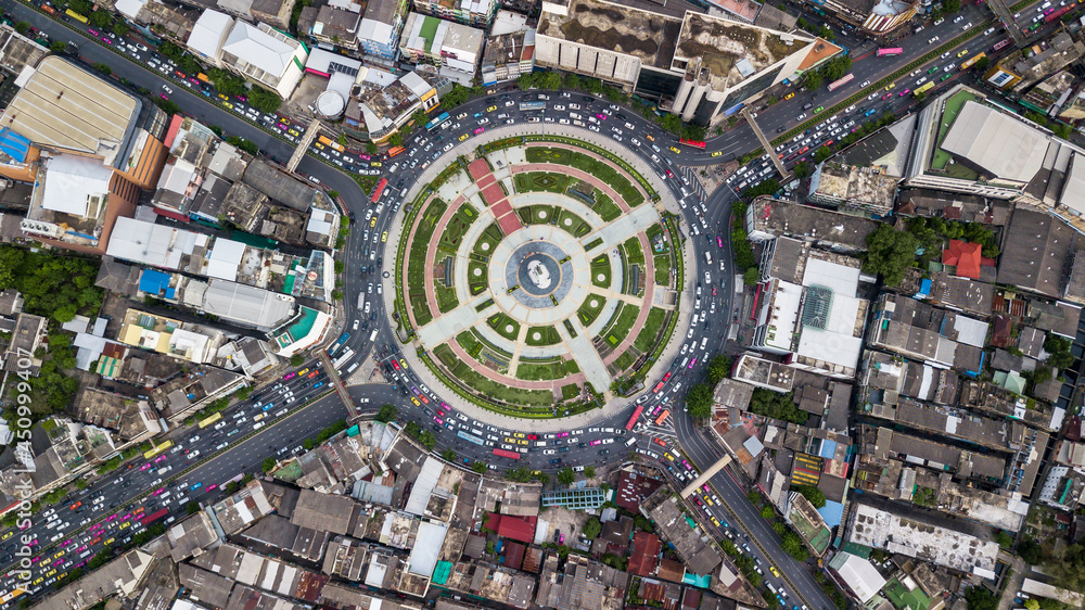 Aerial top view road roundabout with car lots in Bangkok City, Thailand, Circle Road traffic transport junction traffic road with vehicle movement