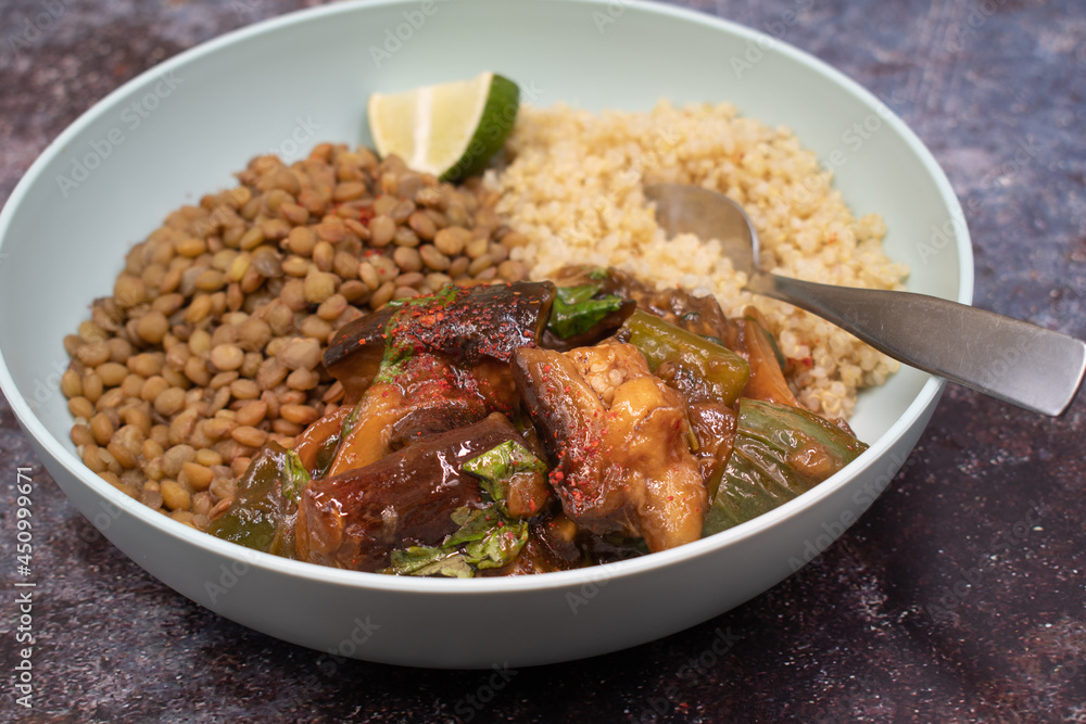 Vegan bowl: lentil and quinoa , eggplant in light blue bowl Vegan bowl: lentil and quinoa , eggplant in light blue bowl