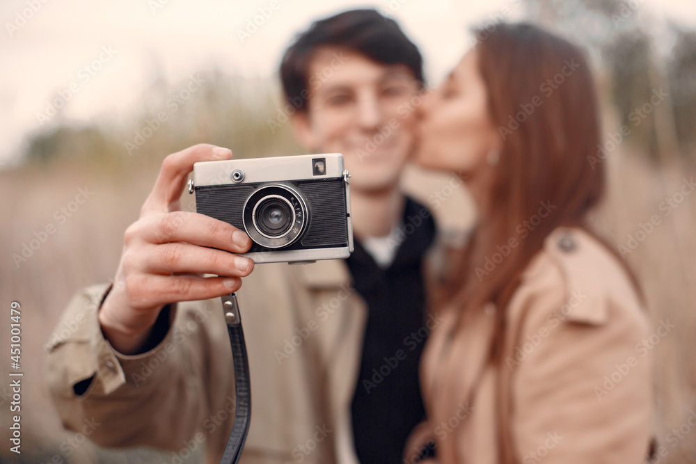 Beautiful couple spend time in a autumn field Beautiful couple spend time in a autumn field