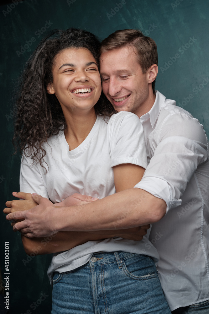 mixed race heterosexual couple loves hugging. Happy together romantic moments