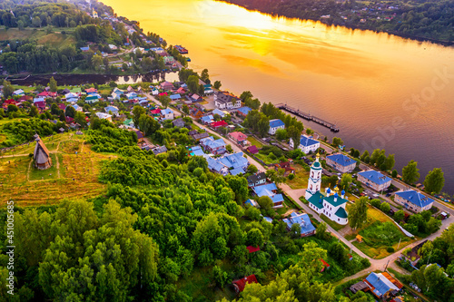 Aerial drone view of ancient russian town Ples on the Volga river with colorful sunset photo