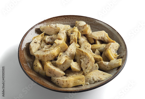 Marinated parts artichoke in oil with herbs.