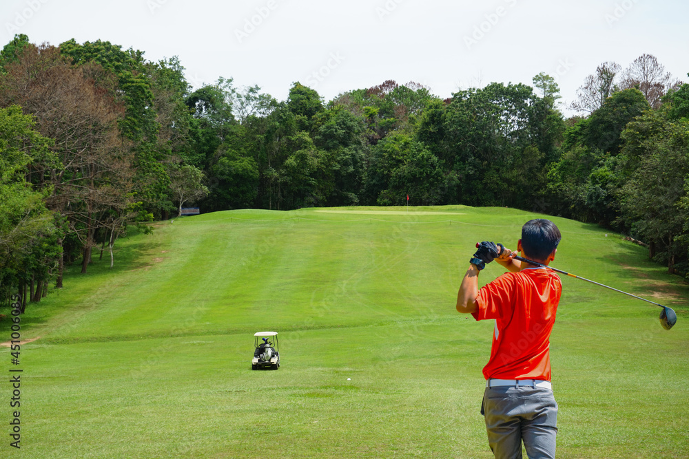 Golfer playing golf in the evening golf course, on sun set evening time. Golfer playing golf in the evening golf course, on sun set evening time.