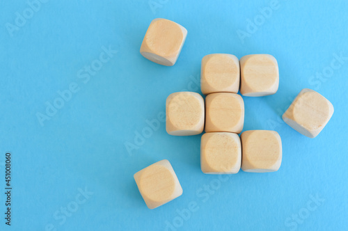 Wooden cube blocks isolated on a blue background