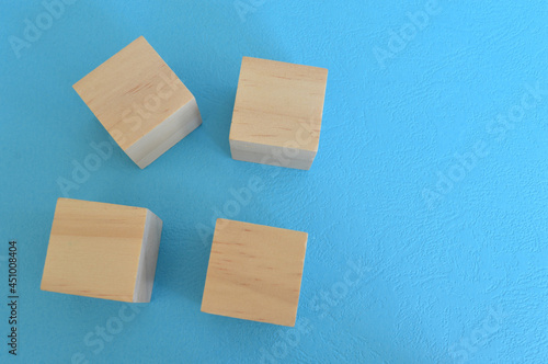 Wooden cube blocks isolated on a blue background