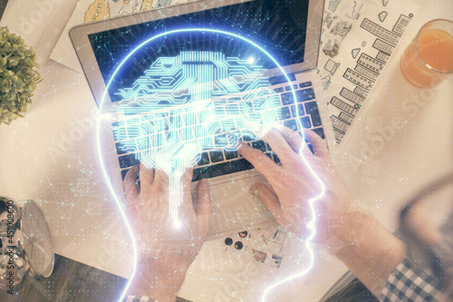 Double exposure of man s hands typing over computer keyboard and brain hologram drawing. Top view. Ai and data technology concept.