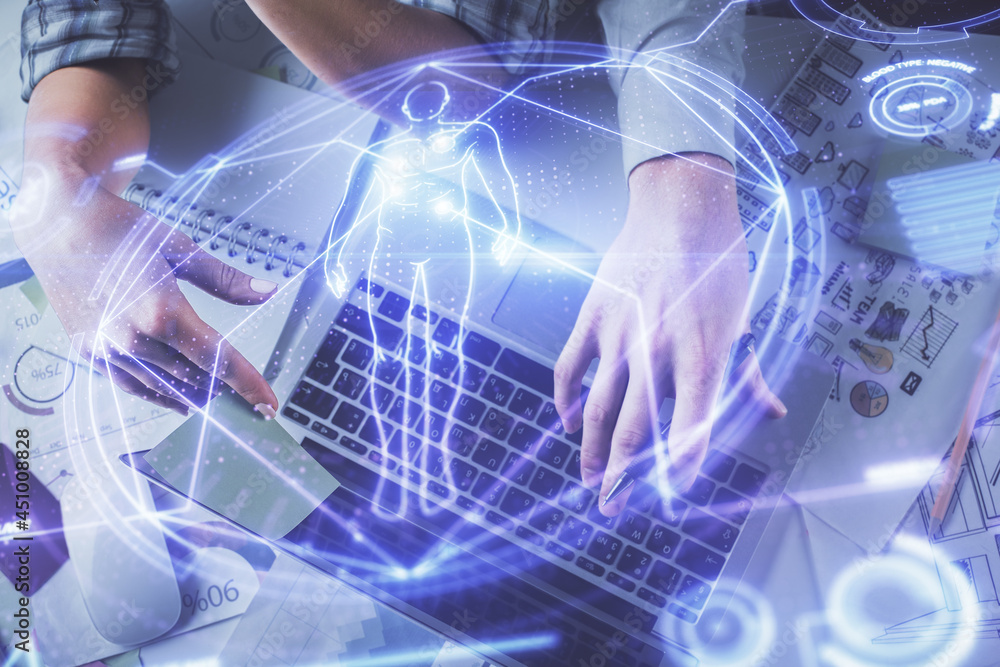 Double exposure of man and woman working together and education theme hologram drawing. Computer background. Top View. Double exposure of man and woman working together and education theme hologram drawing. Computer background. Top View.