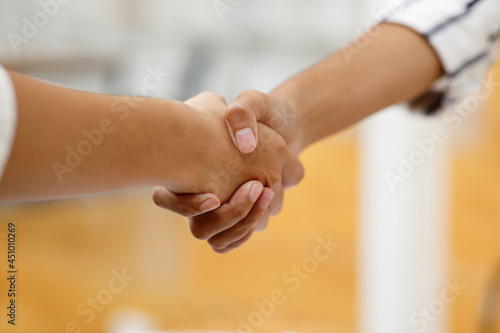 Business handshake for teamwork of business merger and acquisition,successful negotiate,hand shake,two businessman shake hand with partner to celebration partnership and business deal concept