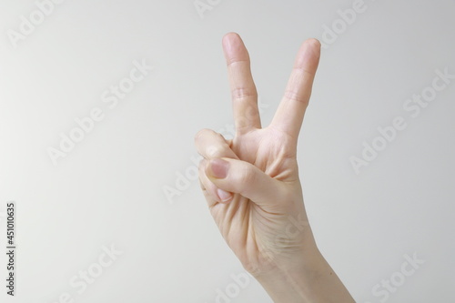 Woman showing two fingers gesture