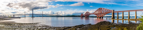 A panorama view from Queensferry of the bridges over the Firth of Forth, Scotland on a summers day