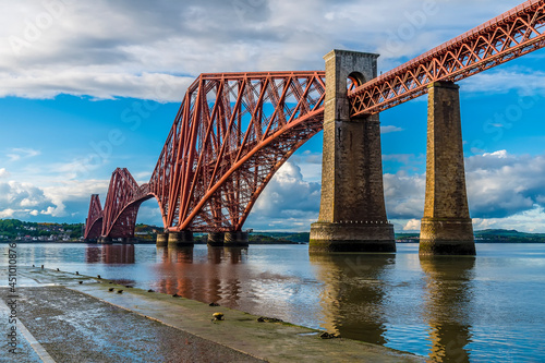 Fototapeta Naklejka Na Ścianę i Meble -  A view from a slipway in Queensferry of the Forth Railway bridge over the Firth of Forth, Scotland on a summers day