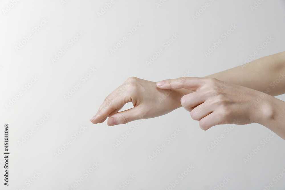 Close up of woman finger touching hand