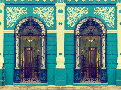 Colonial building facade in Camaguey, Cuba. Toned image.  photo