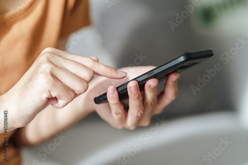 Young Asian woman using smartphone typing, chatting conversation. Social Network, technology concept
