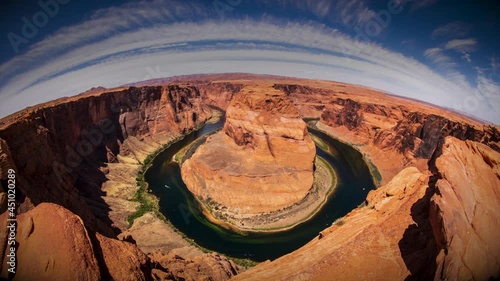 A daytime time-lapse of Horseshoe Bend -- a horseshoe shaped canyon high above the Colorado River near Lake Powell and the Grand Canyon.