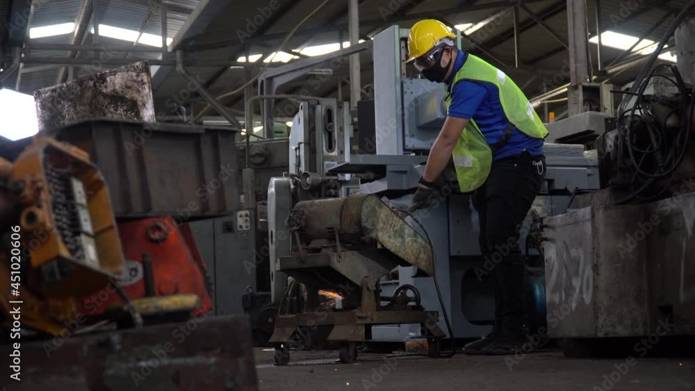 worker cutting steel with Sparks in metalworking in industry factory worker cutting steel with Sparks in metalworking in industry factory