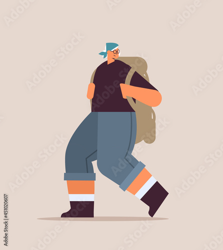 senior woman hiker traveling with backpack active old age physical activities concept