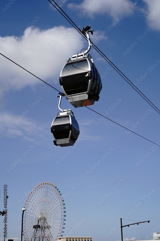 Yokohama air cabin gondola is under blue sky in Minatomirai in Japan. Yokohama air cabin gondola is under blue sky in Minatomirai in Japan.