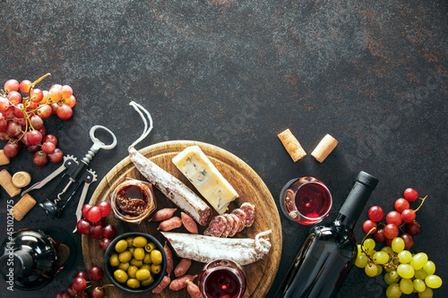 Wine tasting set with a charcuterie board, top-down view photo