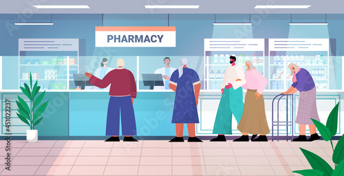 doctor pharmacist giving pills to customers patients at pharmacy counter modern drugstore interior medicine