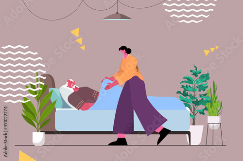 friendly nurse or volunteer supporting elderly man patient lying in bed home care services healthcare concept horizontal full length vector illustration