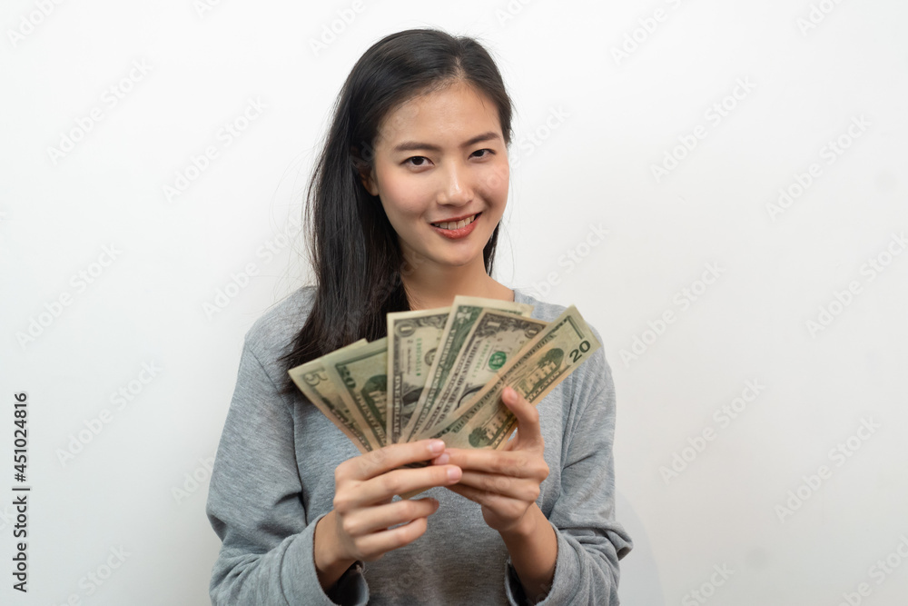 Asian woman holding cash win from bet Asian woman holding cash win from bet