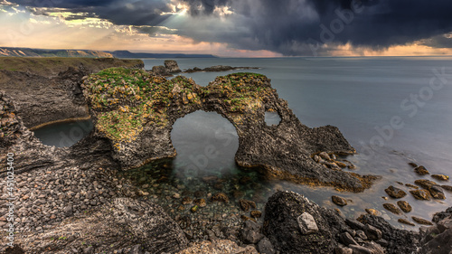 Gatklettur stone arch at Arnarstapi (Iceland) photo
