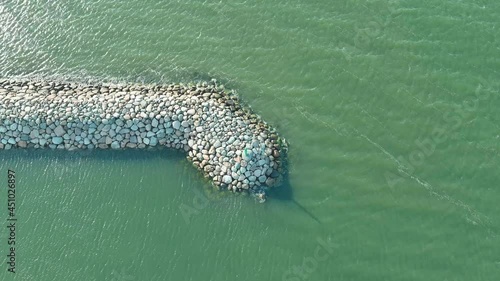 Flying around the stone breakwater