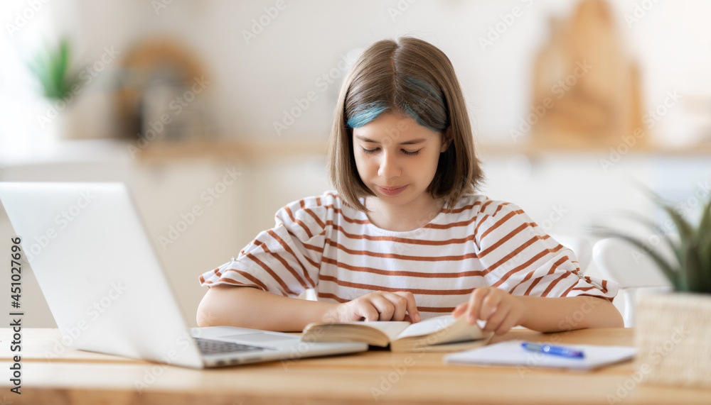 Girl doing homework or online education. Girl doing homework or online education.