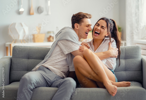 couple having fun and hugging at home.